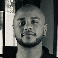 Portrait of Anthony Collins, a professional stylist at Theaology Salon & Day Spa, showcasing their expertise and style.