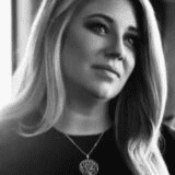 Portrait of Brittany Throm, a professional stylist at Theaology Salon & Day Spa, showcasing their expertise and style.